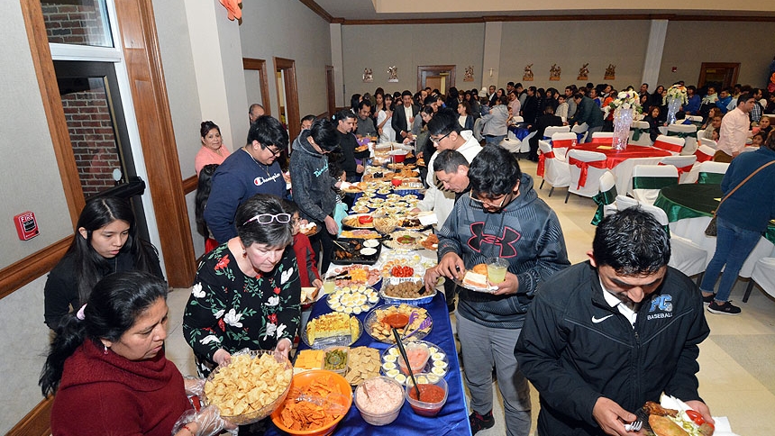 Parishioners attend a reception organized by Martha Brunson and Patty Hardesty.