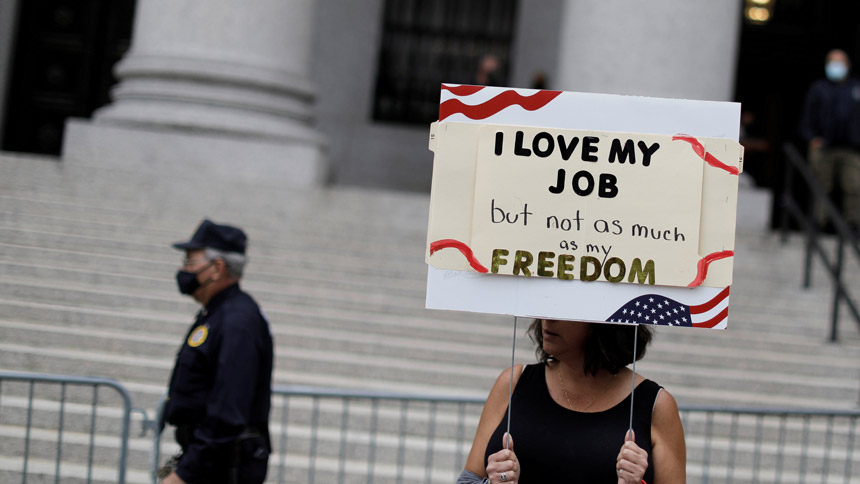 A woman in New York City protests the government's COVID-19 vaccine mandate in front of the U.S. District Court Oct. 12, 2021. (CNS photo/Mike Segar, Reuters)