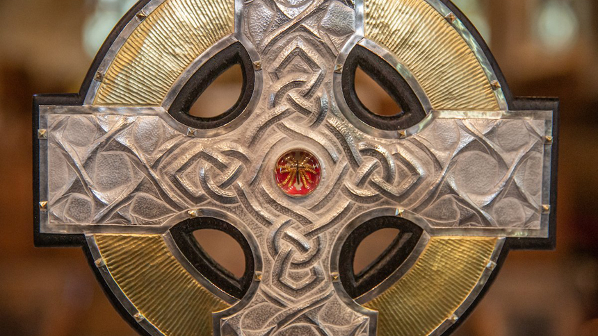 The top of the processional cross that will be used at the coronation of King Charles III in May is seen on the altar of an Anglican parish in Llandudo, Wales, April 19, 2023. Relics of the Christ's cross, a gift from Pope Francis, are under glass in the center of the processional cross. (CNS photo/Dave Custance, courtesy of the Church in Wales)