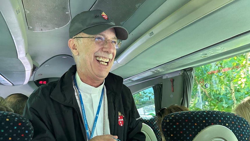 Bishop Luis Zarama on the pilgrimage bus in Portugal